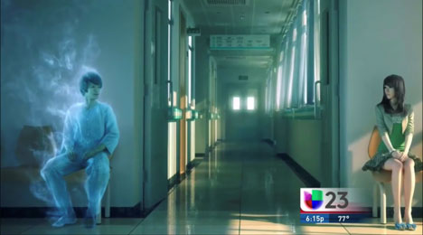 A person in white scrubs walking down the hall way.